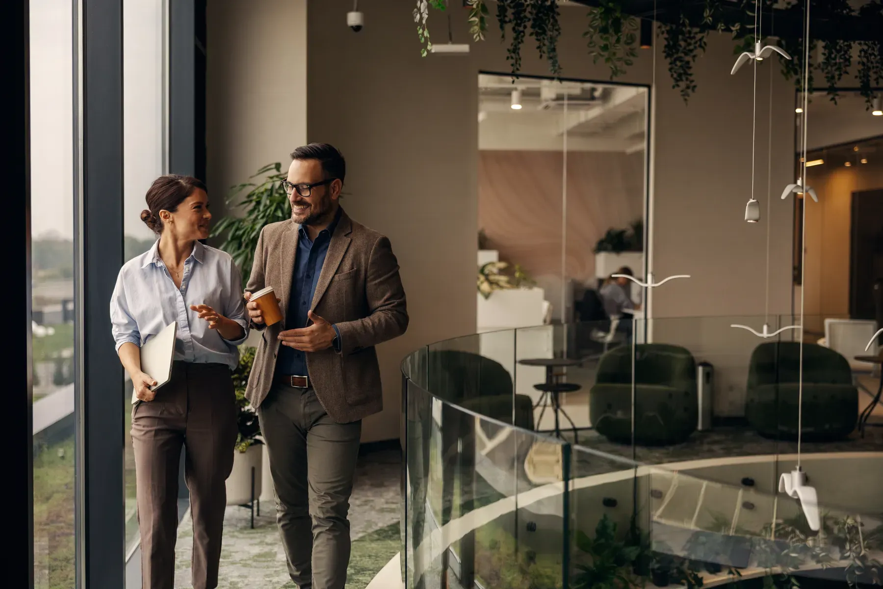 Two CapaOne colleagues talking in the office